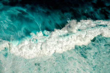 Turquoise ocean sea water white wave pattern splashing deep blue sea. Seascape dark ocean background...