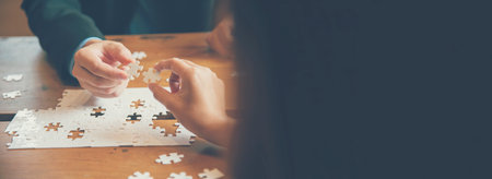 Banner Implement puzzle improve hand holding together solve synergy organize team connection plan trust strategy. Stakeholder business trust teams hands holding jigsaw puzzle synergy with copy spaceの写真素材