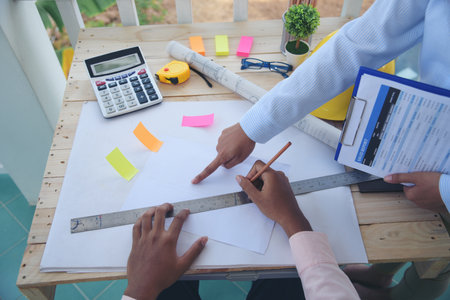 construction business plan deconstruction team consulting partnership. Construction engineer teamwork Safety Suit Trust Team implement honest planning in Construction Site. Trustworthy engineer team.の写真素材
