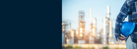 Banner Woman worker hands holding hardhat yellow work helmet Construction Engineer. Panorama Refinery woman worker industry hand hold yellow worker helmet hard hat. Refinery industry with copy spaceの写真素材