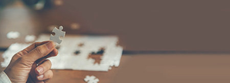 Banner Implement puzzle improve hand holding together solve synergy organize team connection plan trust strategy. Stakeholder business trust teams hands holding jigsaw puzzle synergy with copy spaceの写真素材