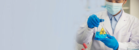 Banner Scientist man look Microscope research in science laboratory. Banner Asian scientist use microbiology microscope in laboratory equipment chemistry lab. Biochemistry experiment with copy spaceの写真素材