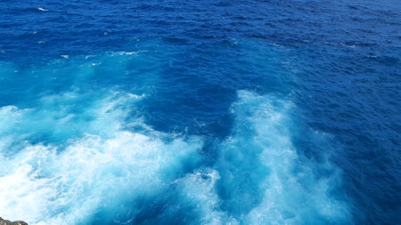 Blue sea marine ocean seascape tropical huge wave on blurred background. Seascape blue ocean white wave motion outdoor. Aqua marine huge wave sea summer background. Paradise turquoise water landscapeの写真素材