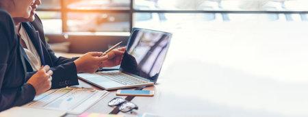 Banner Happy success business woman partner meeting working together in company office. Panoramic picture of Meeting Executive Asian business woman office desk with fist arm raised executive teamworkの写真素材
