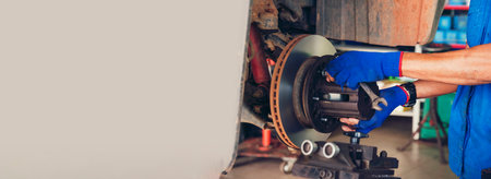 Banner Man hands fixing Car machinery vehicle mechanical service. Mechanic man hands repairing car shop. panoramaopen vehicle hood checking up auto mobile. Car maintenance engineer with copy sapce.の写真素材