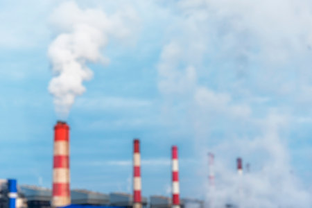 Blurred background Power stations electrical industrial plant. Blurry Electric power building refinery engineering steam smokestack. Defocused Lignite electricity chimney release pollution backgroundの写真素材