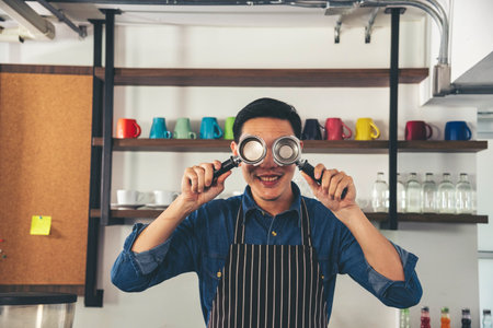 Portrait Barista small business Owner. Asian barista man coffee shop owner smiling look at camera small business confident person Entrepreneur manager professional men standing coffee counter barの写真素材