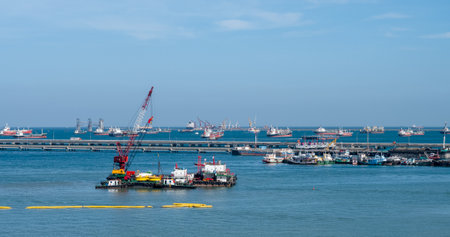 Logistic shipping quay boat Engineering crane depot at logistic export terminal control. Warehouse freight background container yard loading quayside harbor port. Logistics seascape shipping portalの写真素材