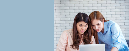 Banner Happy success business woman partner meeting working together in company office. Panoramic picture of Meeting Executive Asian business woman office desk with fist arm raised executive teamworkの写真素材