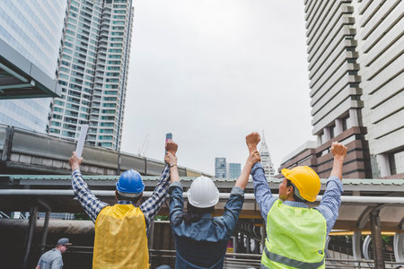Group of multiracial people Teamwork meeting join hands Engineer Manager Foreman fist bump together. Close up diversity engineer people hands partner teams. Business connection team join partnershipの写真素材