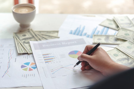 Businessman hands working Excel graph Spreadsheet Document showing business Infographic Financial summary report. Financial Plan Data Accounting Database Report. Business Graphs chart office deskの写真素材