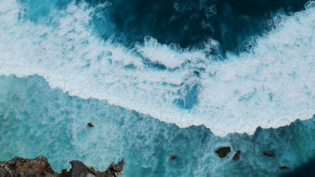 Turquoise ocean sea water white wave pattern splashing deep blue sea. Seascape dark ocean background wave splash on rock. Tropical sea beach in summer seaside outdoor. Water Surface blue wave patternの写真素材