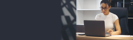 Banner Businesswoman hands type on laptop writing on notebook meeting at office desk. Banner Asian Woman Hands write planning office laptop. Female hand holding pen plan business with copy spaceの写真素材