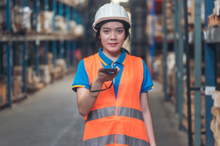 Portrait warehouse women using bar code reader scan goods products on inventory shelf. Asian women...