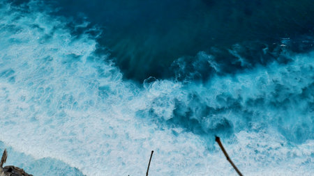 Turquoise ocean sea water white wave pattern splashing deep blue sea. Seascape dark ocean background wave splash on rock. Tropical sea beach in summer seaside outdoor. Water Surface blue wave patternの写真素材