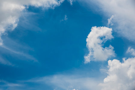 Blue sky fluffy white clouds on summer season bright clear skyline with beautiful cloudscape....