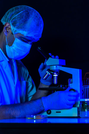Vertical Scientist men in lab look at science microscope medical test researching biology chemistry...