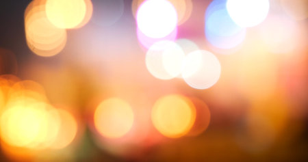 Colorful Bokeh abstract blurred background music festival stage show performance party. Vibrant bokeh background spark animate motion. Backdrop display with twinkling night life shape blinking lightの写真素材