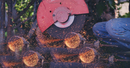 Hot flame welding metal work cutting fire iron workshop. Welding machine iron metal sparking. Locksmith using Welding machine cutting metal processing grinder. Close up hands Sparks in metalworkingの写真素材