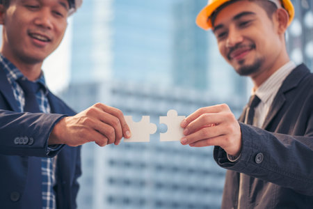 Unified synergy assembly business game implementation multiple puzzle meeting. Business connections strategy synergy team solution. Piece of jigsaw assembly by implement multiple game puzzle. Hands of unify team connect group of business people solutions strategyの写真素材