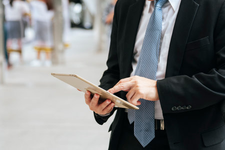 Asian businessman wear suit eyeglasses standing street modern city. Young handsome asian business...