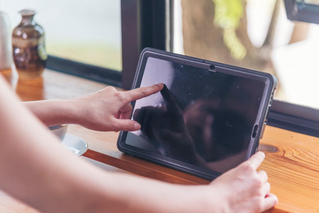 Woman hands using smartphone digital technology tablet empty blank screen. Close up Hands women...