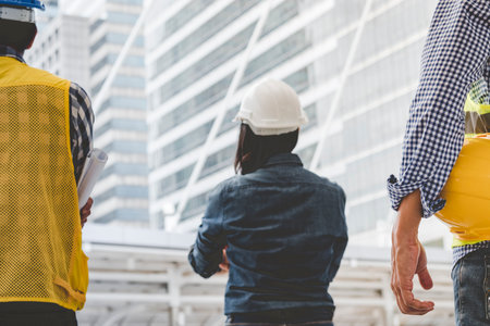 Helmet construction Engineer team. Men hands holding hardhat yellow work helmet in Civil...