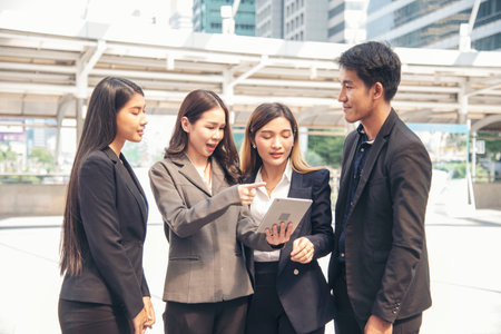 Diversity Business Partner meeting trust in teamwork and partnership businessman, businesswoman talking together in modern city. Asian coworker team meeting with Business People Working Together Teamの写真素材