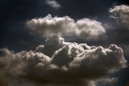 Dramatic dark storm thundercloud rain clouds on black sky background. Dark thunderstorm clouds...