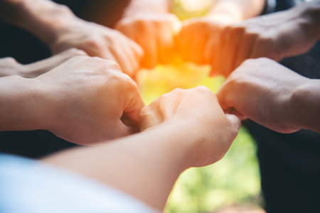 Diverse multiethnic Partners hands together teamwork group of multiracial people meeting join hands...