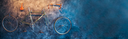 Vintage Bicycle on the wall decorate with bike cycle wheel in living room.Interior Design with people lifestyle hobby in a modern city. Bicycle with bulb lighting as background and loft decorate styleの写真素材