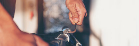 Banner Man hands fixing Car machinery vehicle mechanical service. Mechanic man hands repairing car shop. panoramaopen vehicle hood checking up auto mobile. Car maintenance engineer with copy sapce.の写真素材