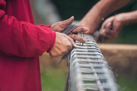 Construction Men hands bending cutting steel wire fences bar reinforcement of concrete work. Worker hands using pincer pliers iron wire. Outdoor Worker using wire bending pliers, construction workの写真素材