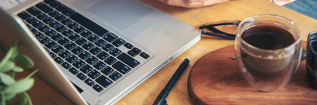 Banner Office laptop business financial document chart and graph on office wooden table coffee cup....
