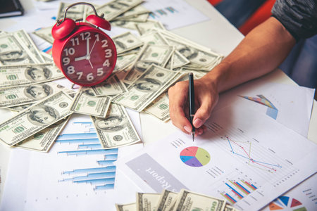 Businesswoman hands note meeting document in conference room. Woman Hands writing planning on notebook. Female hand holding pencil write on diary sketchbook. Business Planning Concept.の写真素材