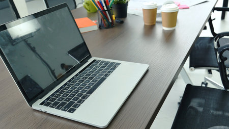 Banner Office laptop business financial document chart and graph on office wooden table coffee cup. Panorama Flat lay notebook computer laptop on office desk. Business stuff mockup with copy spaceの写真素材