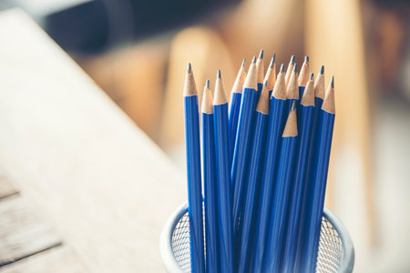 Banner sharp HB pencil vase office supply decor on wood table. Green decorate home office desk. Banner Wood office desk sharpen blue 2B pencil box home office decorate table with copy spaceの写真素材