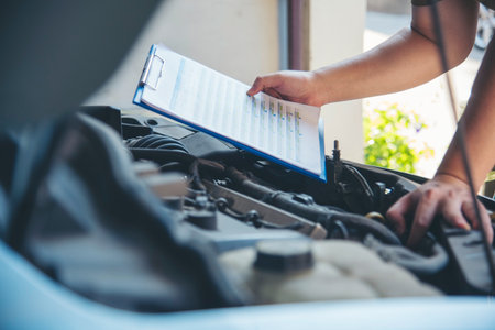 Close up Man hands fixing Car machinery vehicle mechanical service. Mechanic man hands repairing car...