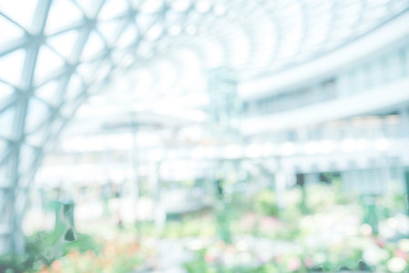 Blurred background hospital healthcare white bokeh with copy space. Blue clean bright blurry background medical laboratory backdrop. Interior lobby simple living space light bokeh. Blurry hallwayの写真素材
