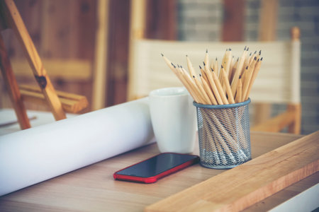 Banner Plant pot sharp pencil vase office supply decor on wood table. Green decorate home office desk. Green plant vase on wood office desk sharpen pencil box office decorate table with copy spaceの写真素材