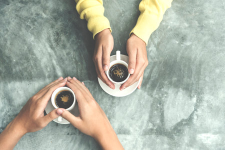 Banner Asian Business people smiling Relax holding cup of coffee in modern city. Couple lover enjoy drinking takeaway hot coffee together. Young Business people holding cup of coffee with copy spaceの写真素材
