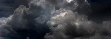Banner Dramatic dark storm clouds black sky background. Dark thunderstorm clouds rainny season....