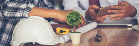 Banner civil construction engineer teams meeting on construction site. Partner team engineering foreman teamwork consult together. Panorama group engineer office meeting partnership with copy spaceの写真素材