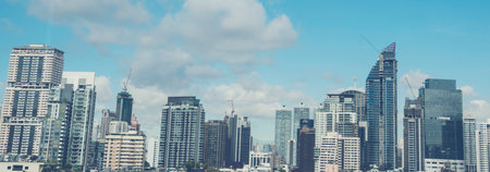 Banner Amazing panorama view of Bangkok city skyline with blue sky. Beautiful skyscraper bangkok midtown landscape. Panorama Capital building background modern office district with copy space.の写真素材