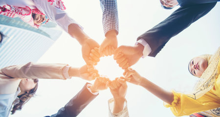Banner diversity solidarity team multiethnic Partners hands together teamwork. Group of multiracial...