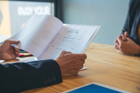 Job HR applicants having an interview with Human resource manager jobs interviewing with confident candidate at business firm office give cv resume. Job Interview with headhunter agent and applicantの写真素材