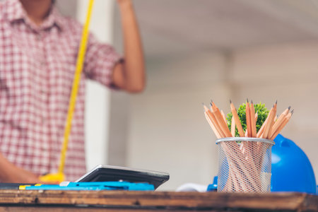 Banner construction engineer office desk architect workplace. Banner engineer draw blueprint objects table hard hat engineering stuff on desk. Designer Objects draft workplace table with copy spaceの写真素材