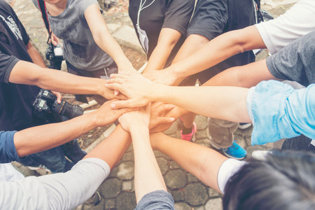 Concept partnership. Group of Partners Team with hands together trusted each friends. Hands stacked...