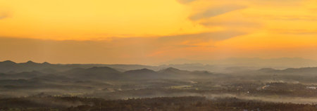 Banner Scenic view dramatic beautiful sunset sky. Panorama Natural Sunset Sunrise on meadow silhouette shadow dark land. Vibrant dramatic sky in Countryside. Landscape Sky At Sunset with copy spaceの写真素材