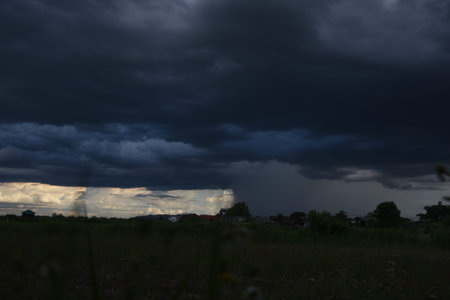 Dramatic dark storm rain clouds black sky background. Dark thunderstorm clouds rainny atmosphere....